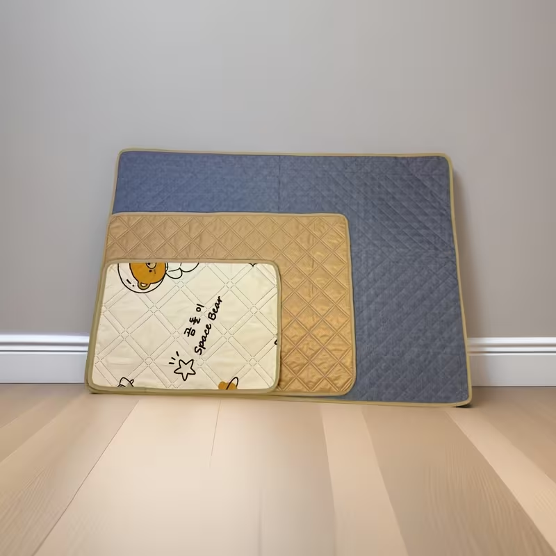 Pet training potty mats with cute cartoon dog and cat designs.
