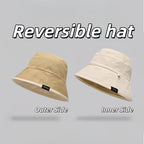 Reversible bucket hat with a narrow brim.