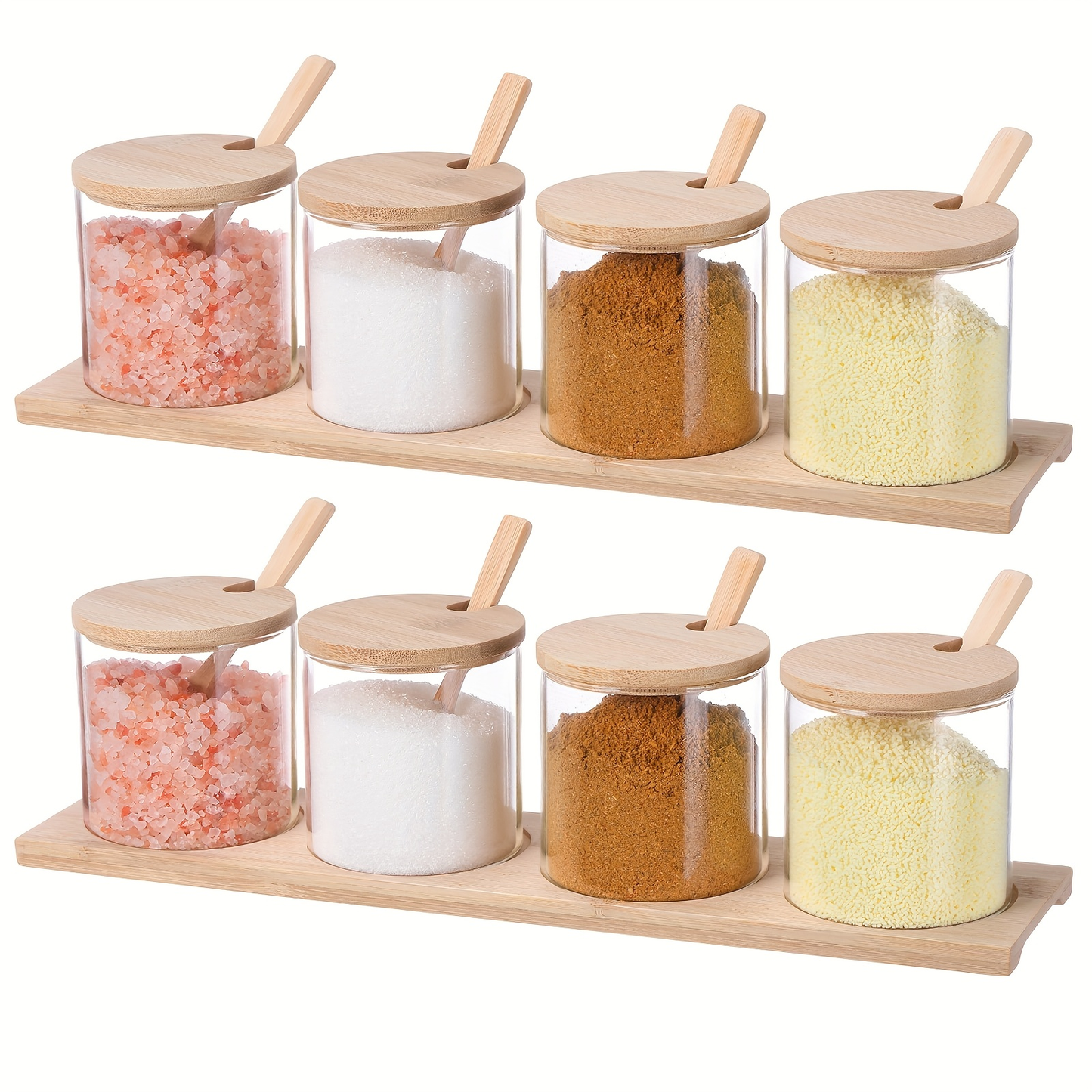 Eight 10-ounce clear glass spice jars with wooden lids and spoons.