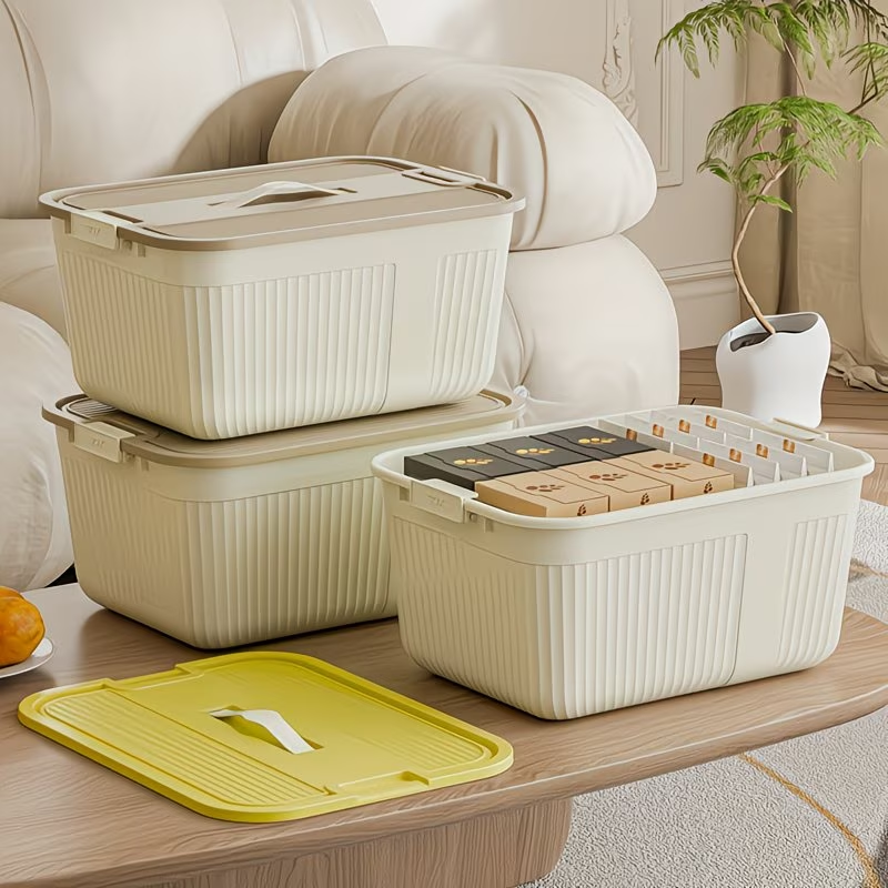 Three plastic storage boxes with lids, snaps, and handles, suitable for home organization.
