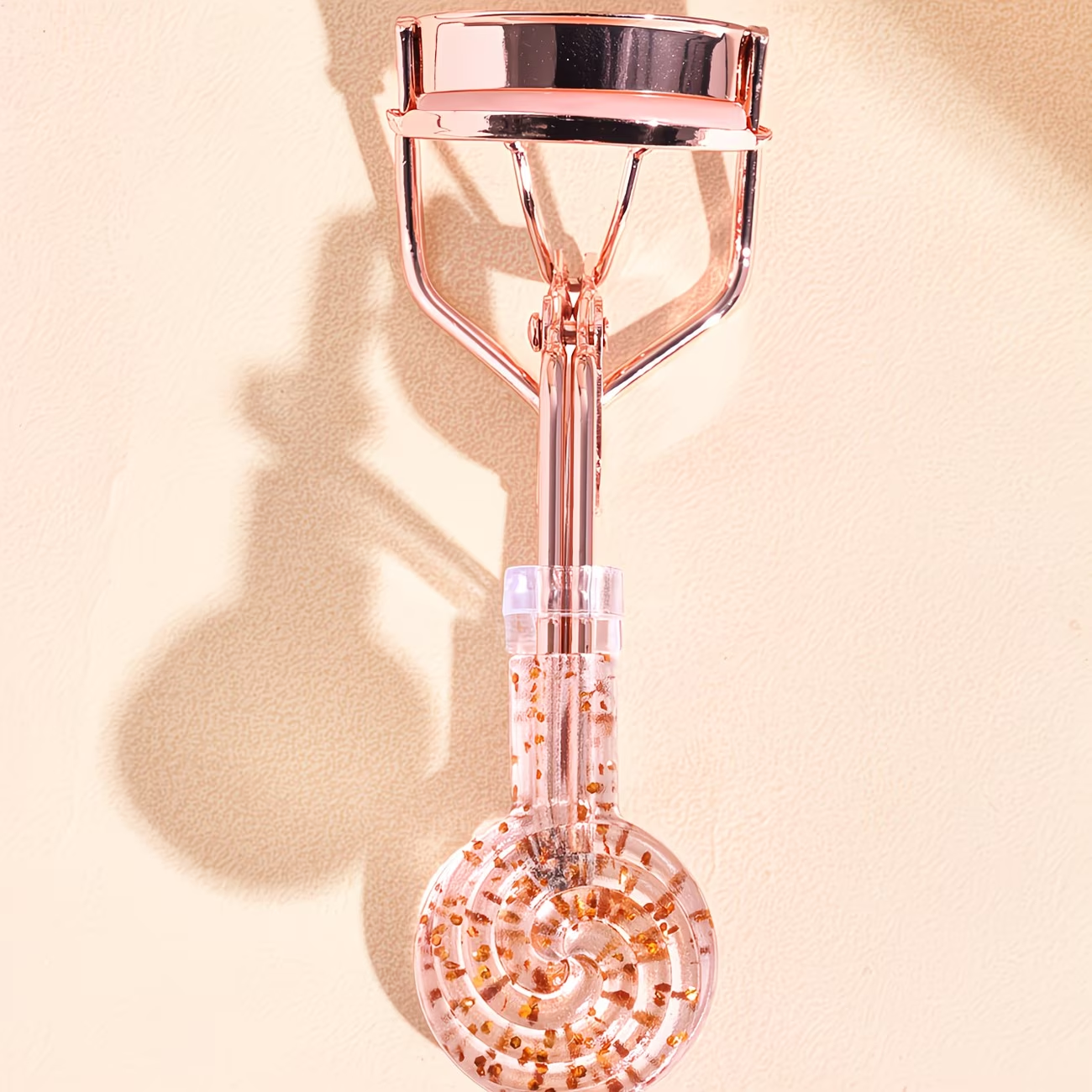 A fashionable and luxurious transparent eyelash curler with curled lashes