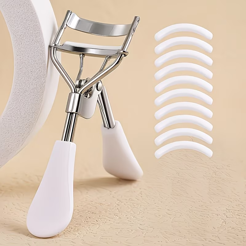 A professional eyelash curler with 10 replacement pads