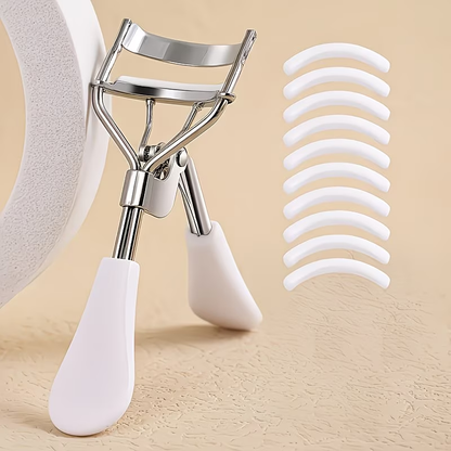 A professional eyelash curler with 10 replacement pads