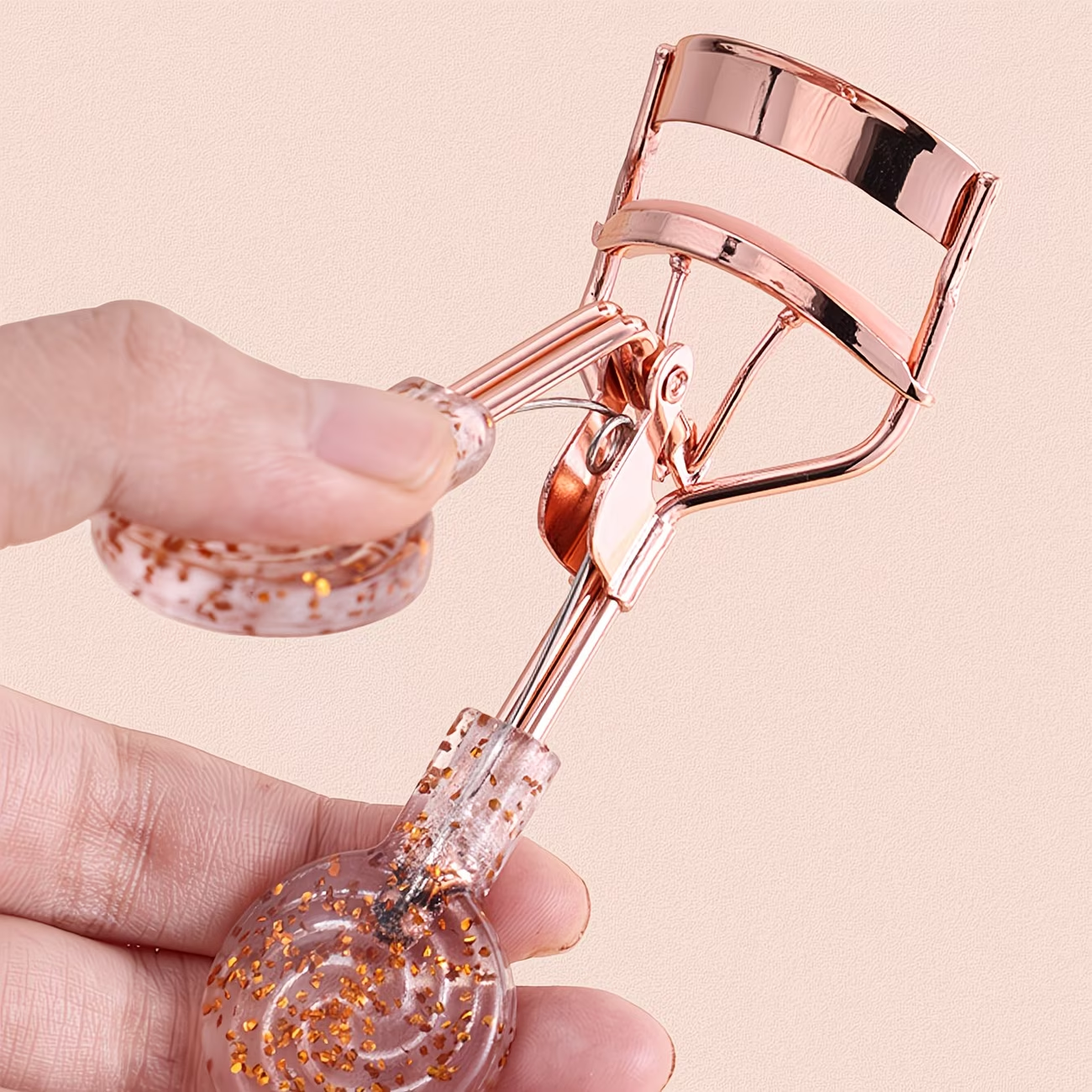 A fashionable and luxurious transparent eyelash curler with curled lashes