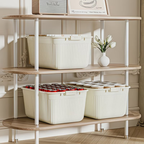 Three plastic storage boxes with lids, snaps, and handles, suitable for home organization.