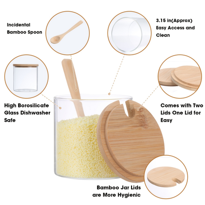 Eight 10-ounce clear glass spice jars with wooden lids and spoons.