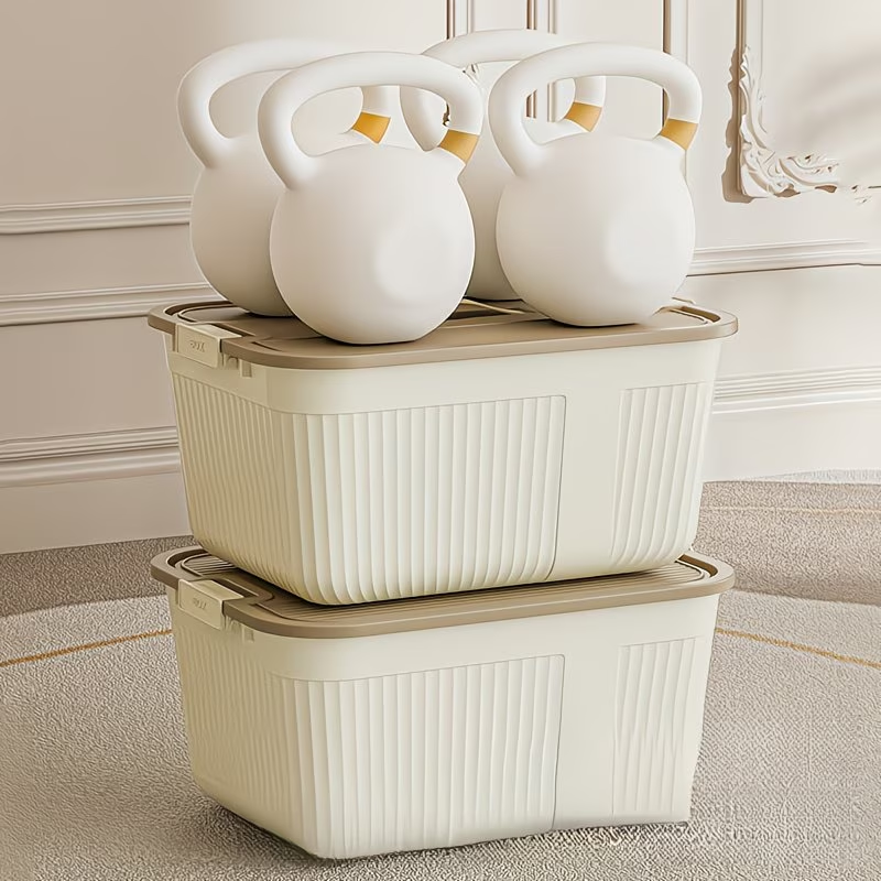 Three plastic storage boxes with lids, snaps, and handles, suitable for home organization.