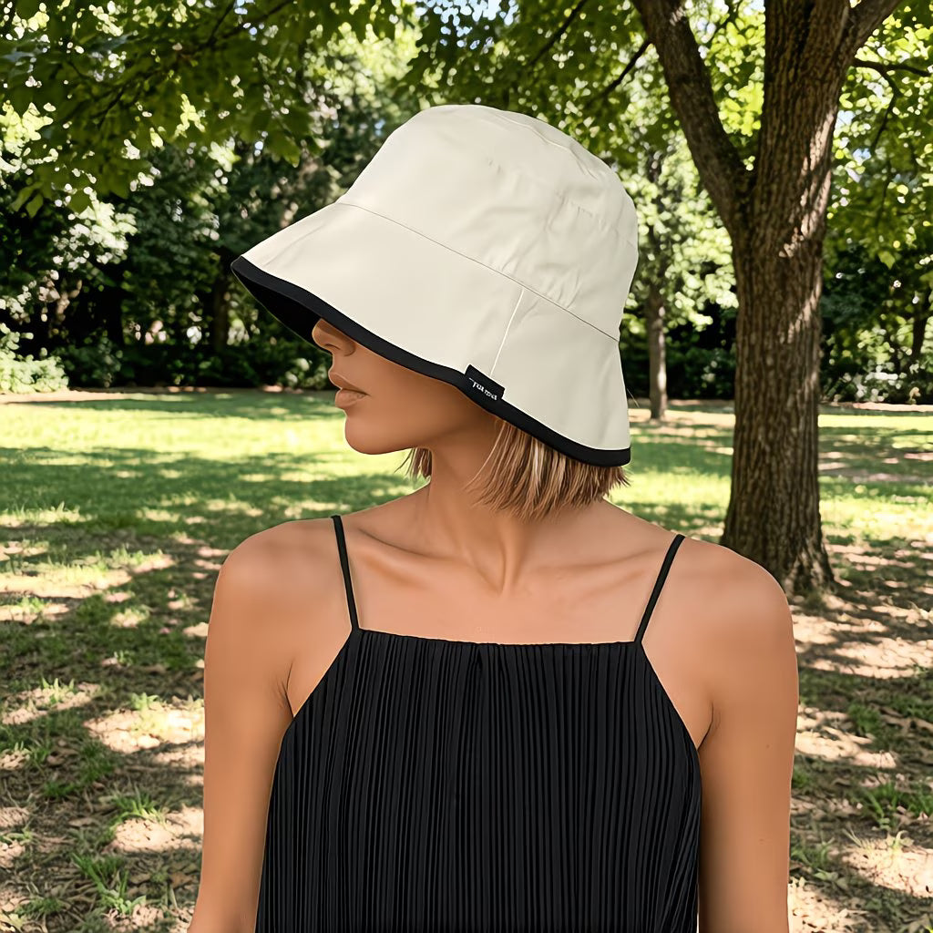 Reversible bucket hat with a narrow brim.