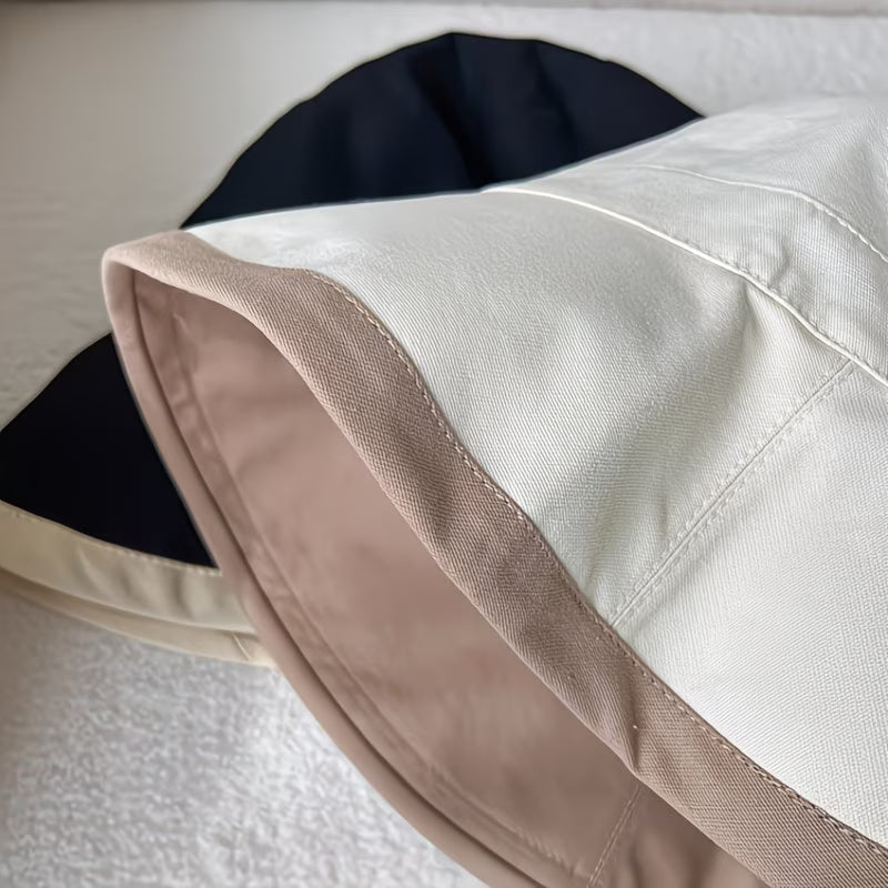 Reversible bucket hat with a narrow brim.