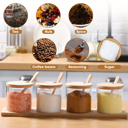 Eight 10-ounce clear glass spice jars with wooden lids and spoons.